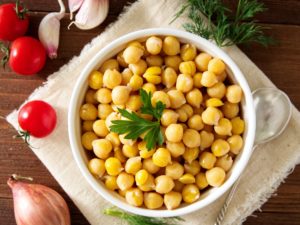 Cooked Chickpeas on bowl on dark wooden table. Healthy, vegetari
