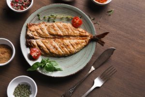 White fish juicy fillet grilled on barbecue